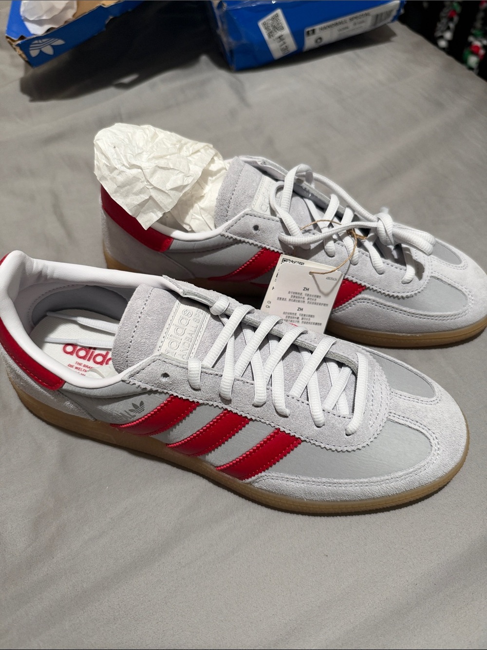 adidas Men’s silver Sneakers with Red Three-Stripes